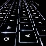 closeup photo of black and white Apple keyboard keys